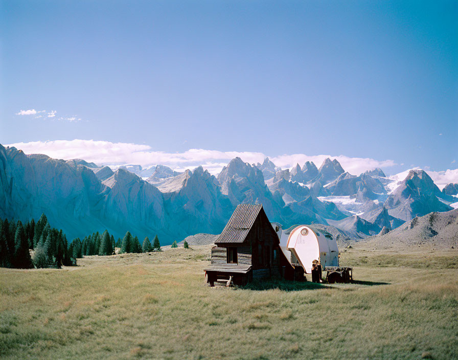 Rustic cabin with satellite dish in mountain landscape