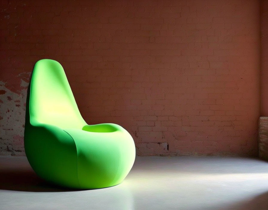 Modern Green Chair with Unique Curvy Design Against Red Brick Wall