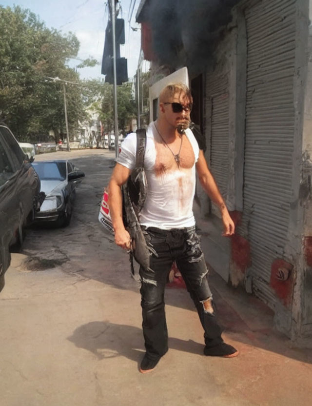 Blonde Man in Sunglasses, White Tank Top, and Black Jeans Walking on Street