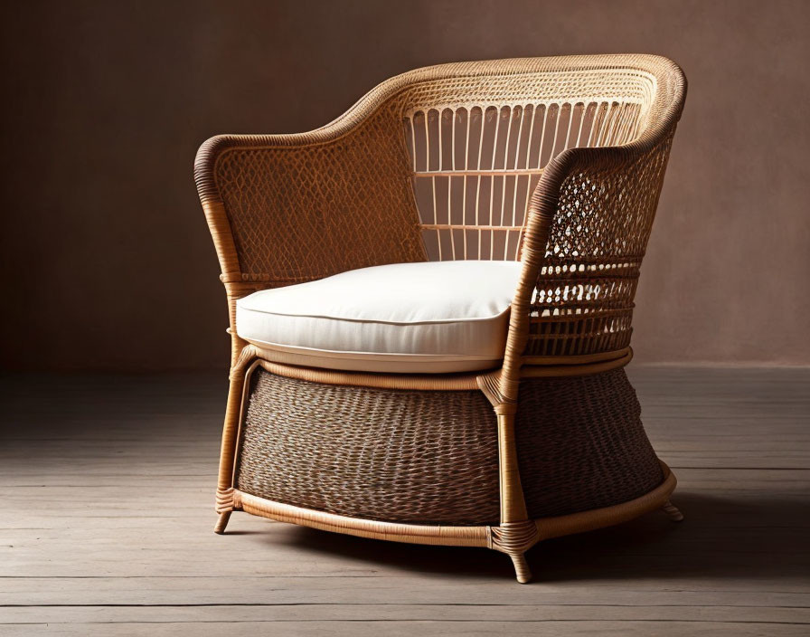 Rattan armchair with white cushion on wooden floor