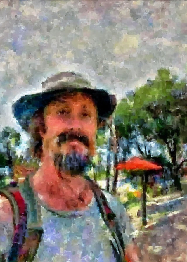 Bearded person in hat taking selfie with impressionistic background