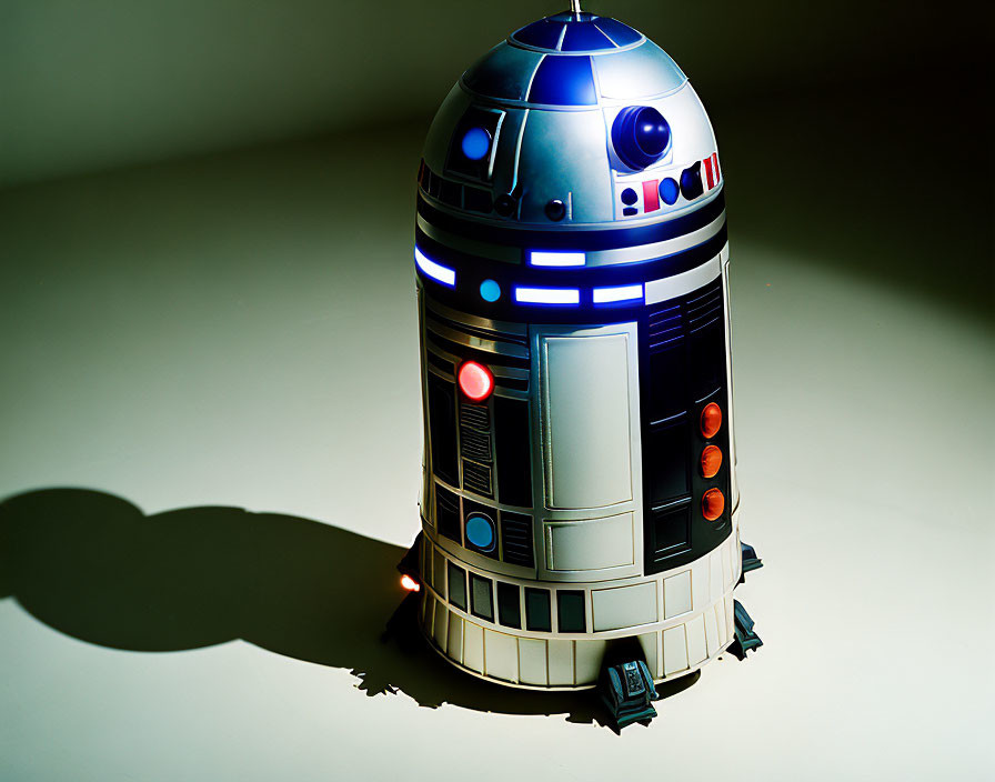 Star Wars R2-D2 toy model casting shadow on light surface