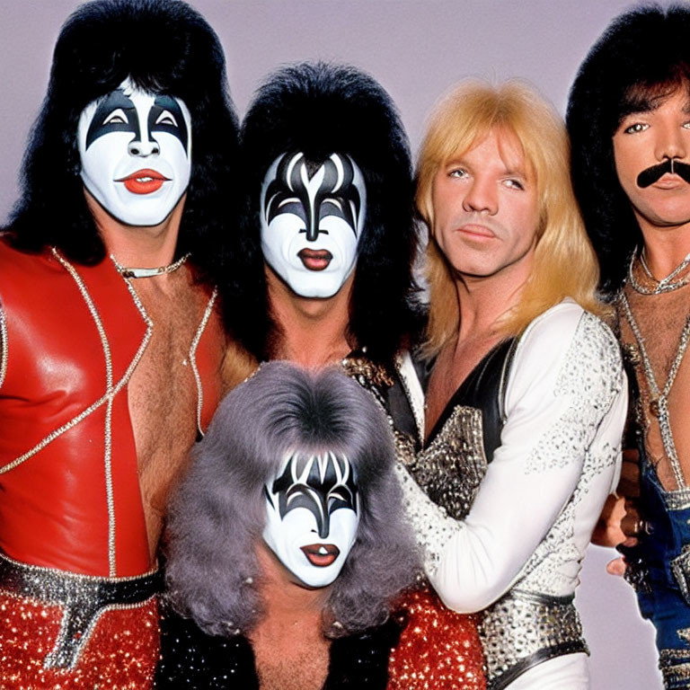 Group of Four Individuals in Glam Rock Makeup and Costumes