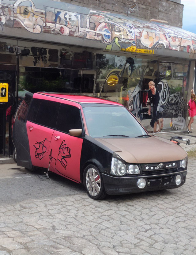 Black and Pink Sneaker-Inspired Car Parked in Front of Shoe-Themed Store