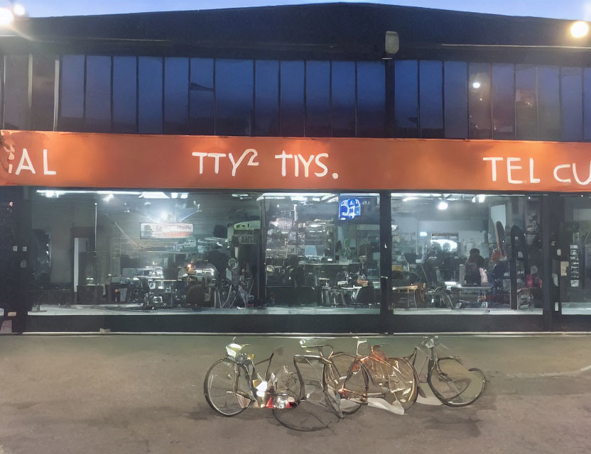 Barbershop at Dusk: Interior with Barber Chairs, TV, Bicycles