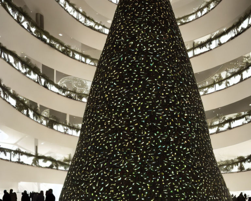 Indoor Christmas tree with twinkling lights and silhouetted figures