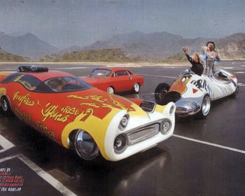 Custom-painted hot rod cars on mountain road with waving people