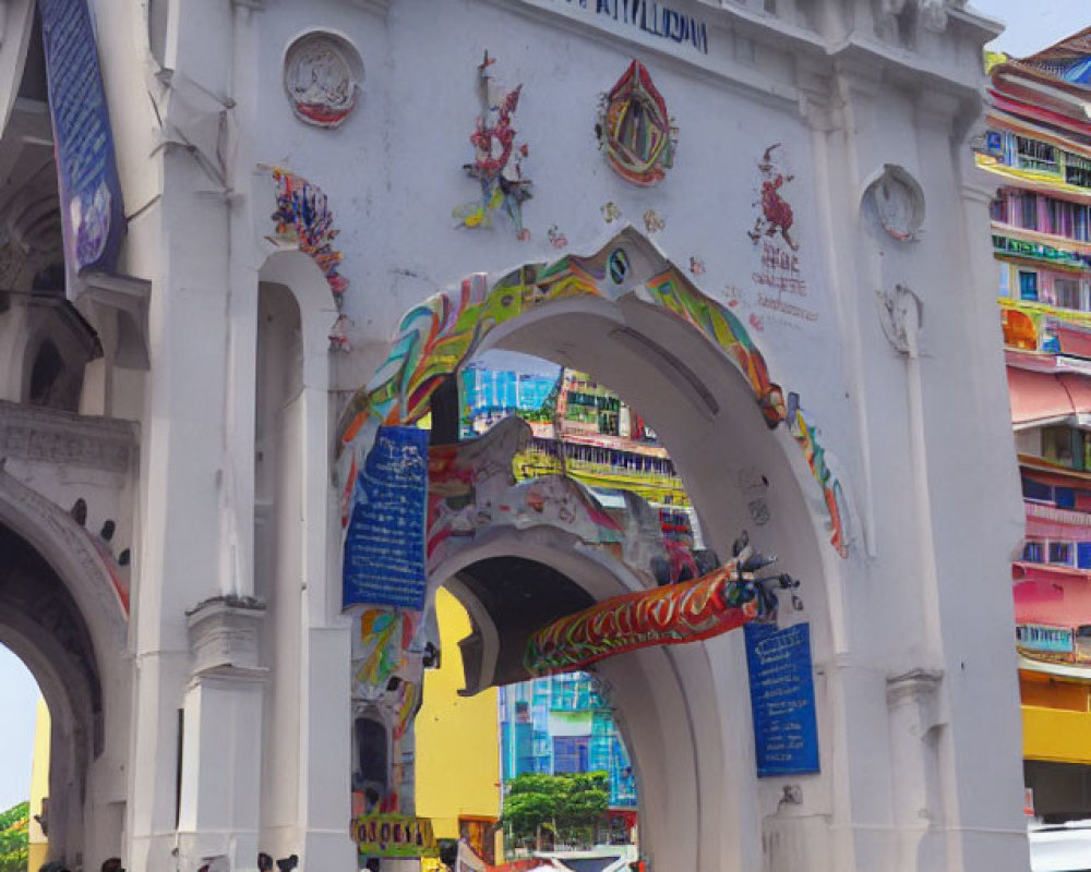 White Archway with Colorful Decorations and Vibrant Building Beyond