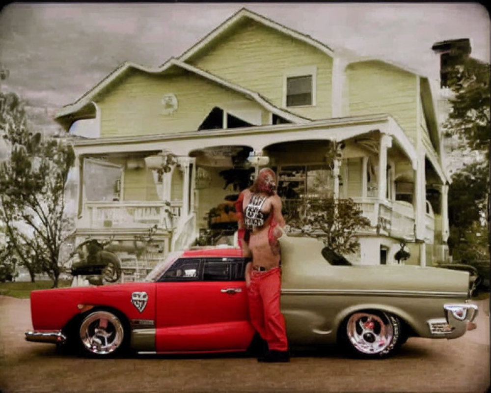 Person in red pants leaning on vintage beige car in front of classic two-story house