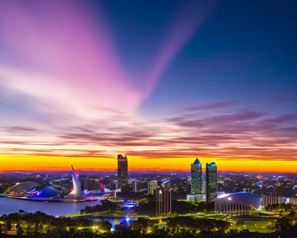 City skyline at sunset with purple clouds, skyscrapers & waterfront park