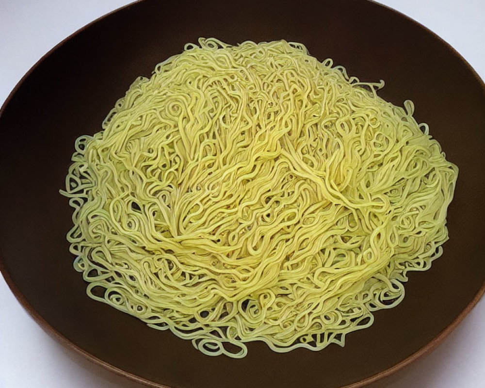 Neatly arranged uncooked instant noodles in dark bowl