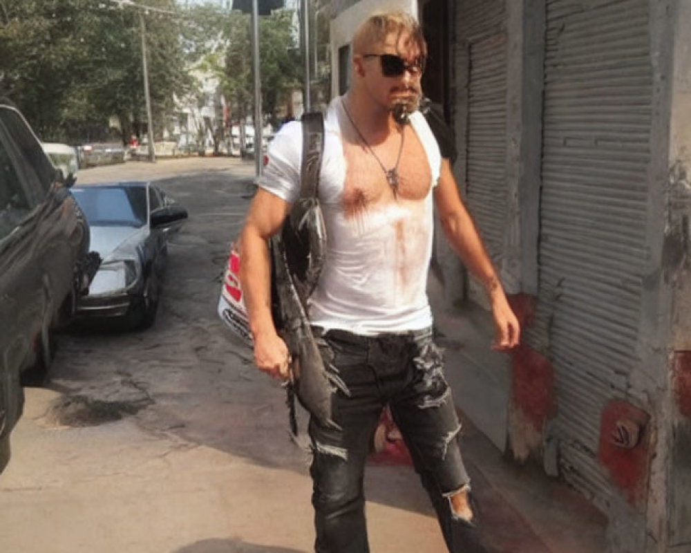 Blonde Man in Sunglasses, White Tank Top, and Black Jeans Walking on Street