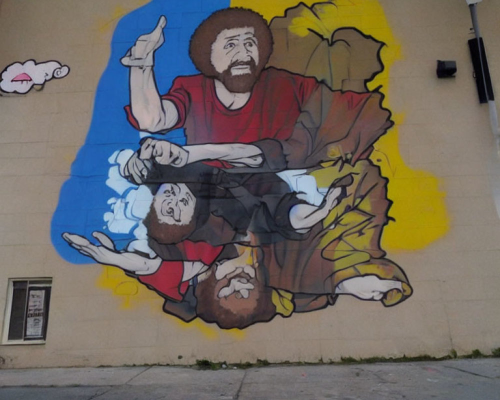 Vibrant street mural: Identical bearded figures, one upright, one upside-down, on