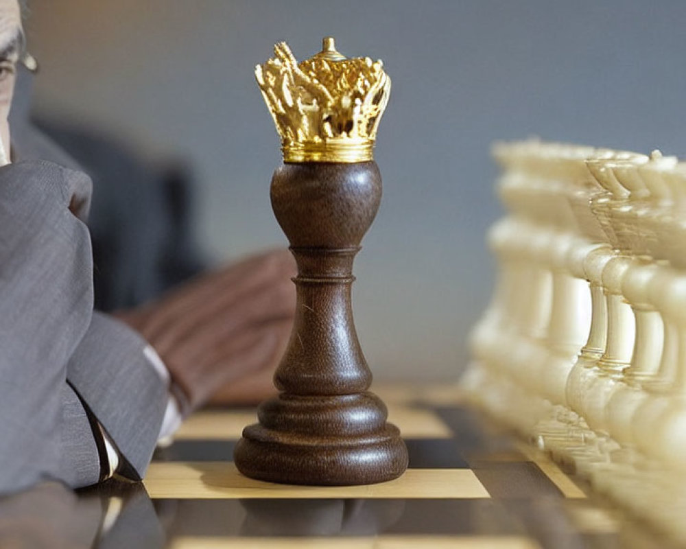 Contemplative individual watching chess game with focus on king piece