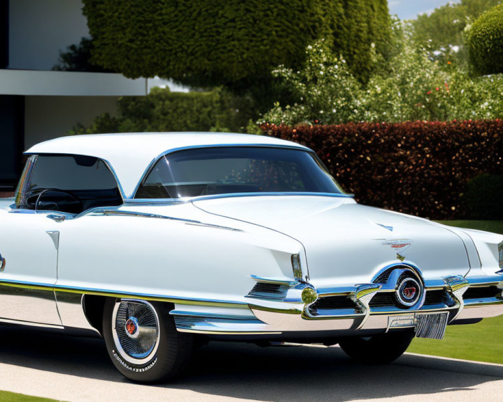 Vintage Blue Car with White-Wall Tires in Manicured Driveway