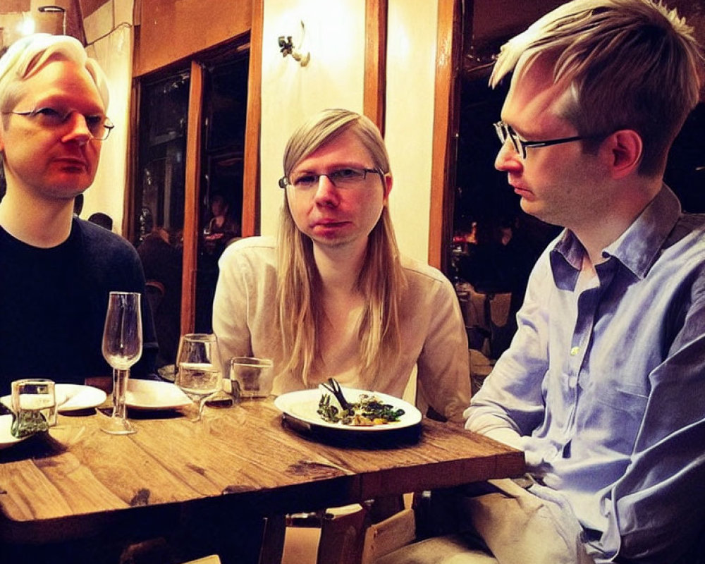 Three People with Matching Hairstyles Dining at Restaurant Table