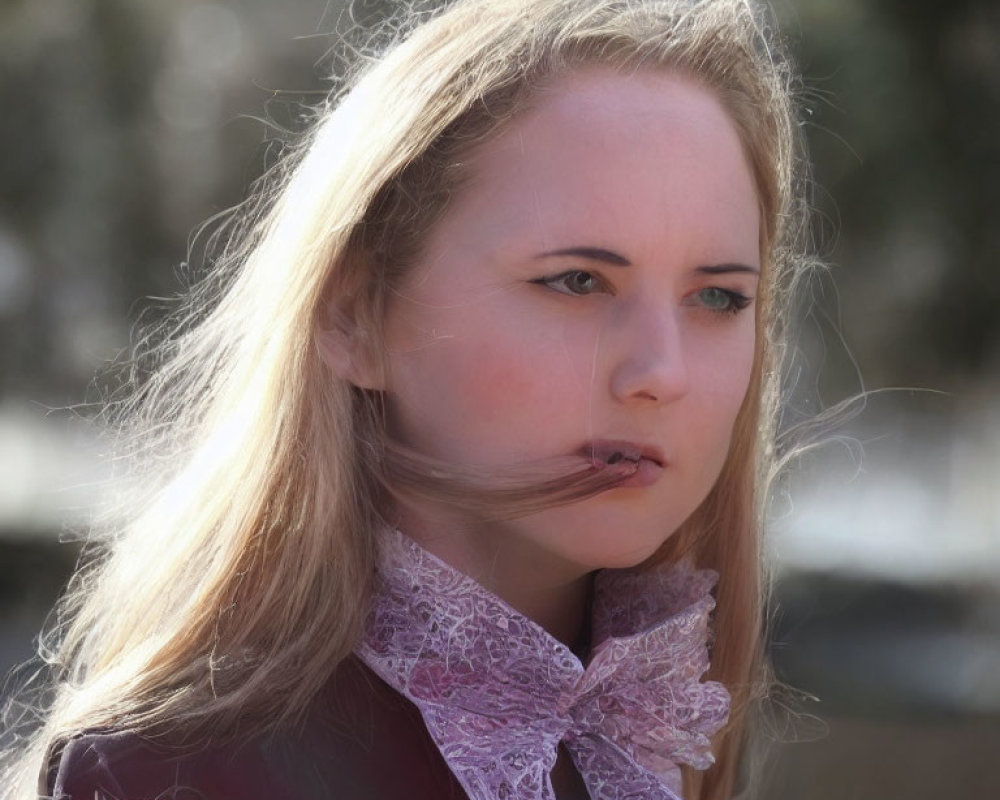 Blonde woman with lace collar gazes pensively outdoors