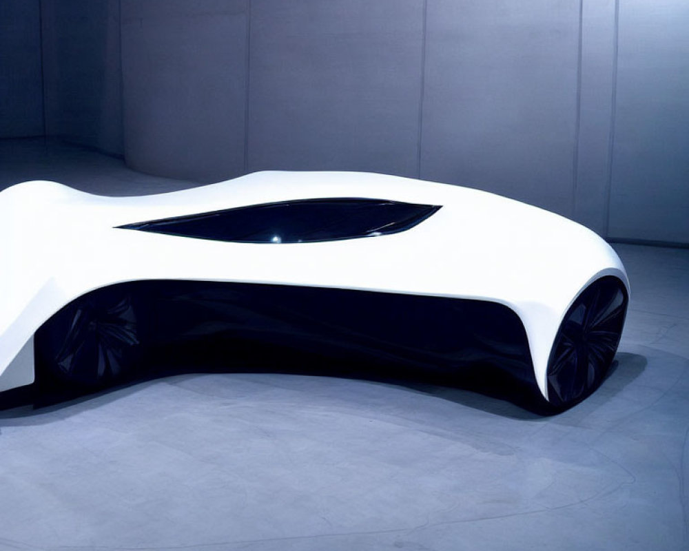 Sleek White Concept Car with Black-Tinted Windows on Grey Background