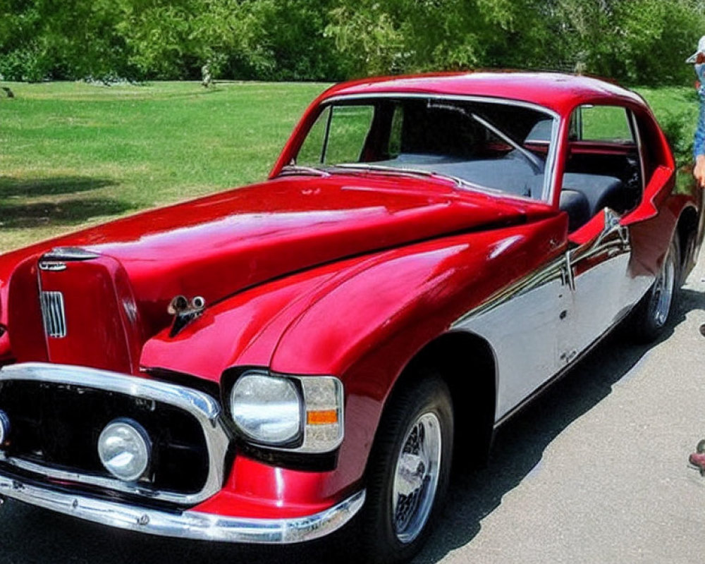 Vintage Red Car with Unique Front Grille Design and Chrome Accents