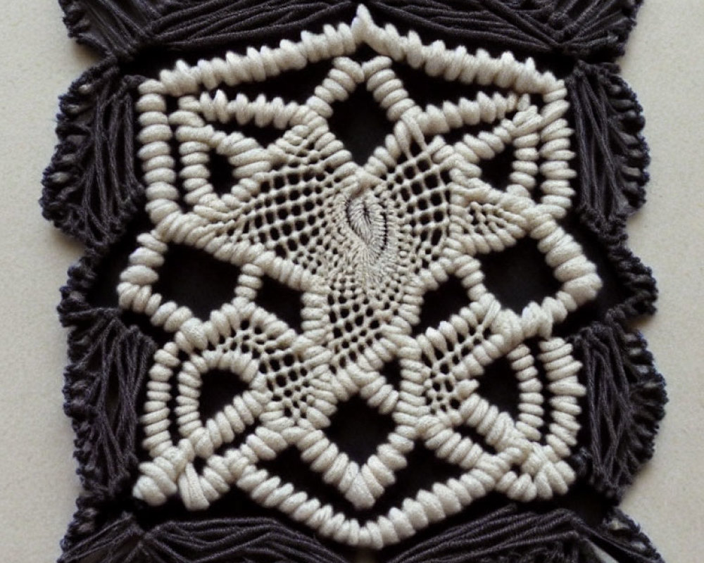 Geometric black and white macramé with tassels and intricate patterns