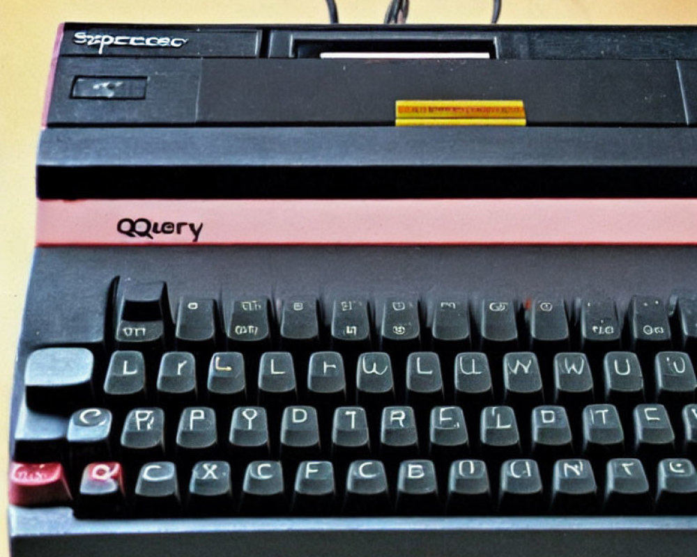 Classic Vintage Computer Keyboard with Black Keys on Beige and Black Background