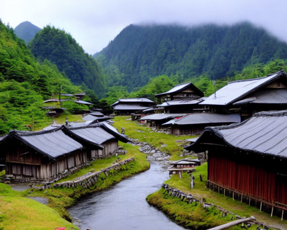 Traditional village with wooden houses, river, and misty mountains