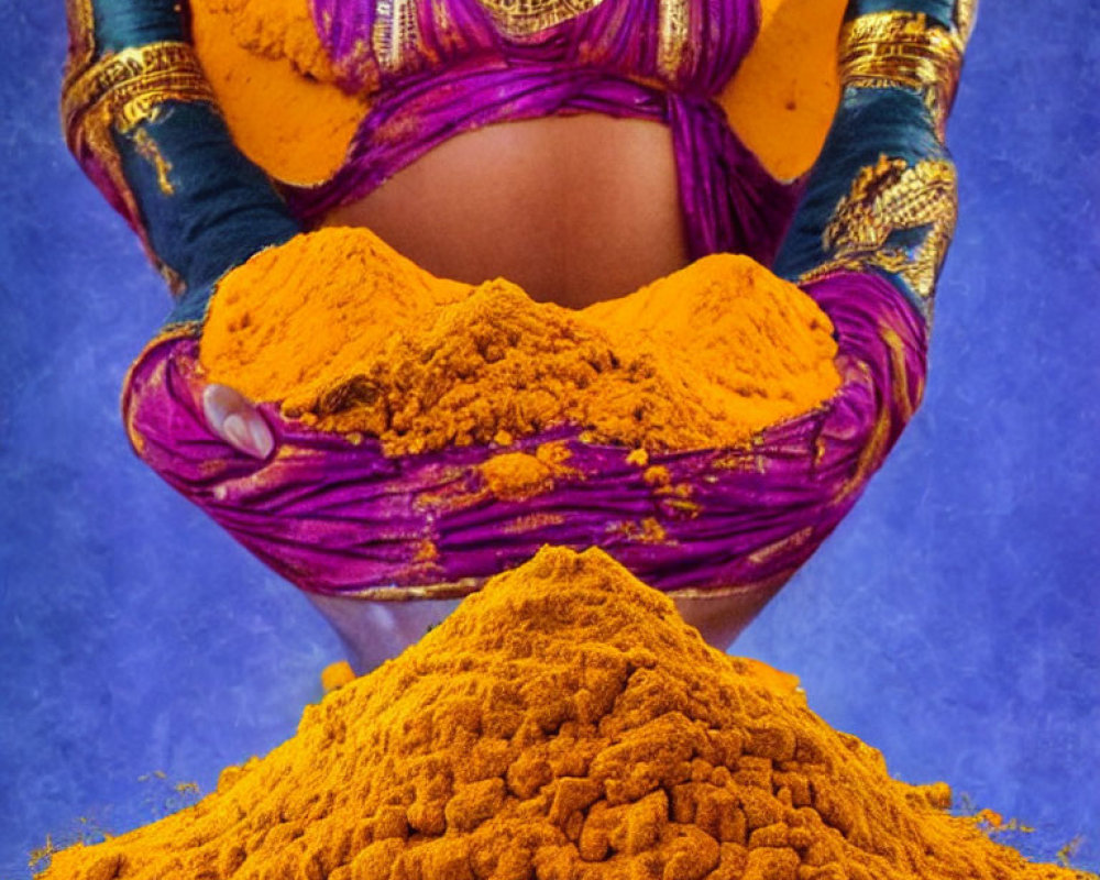 Person's Cupped Hands Covered in Orange Powder with Purple and Blue Traditional Clothing