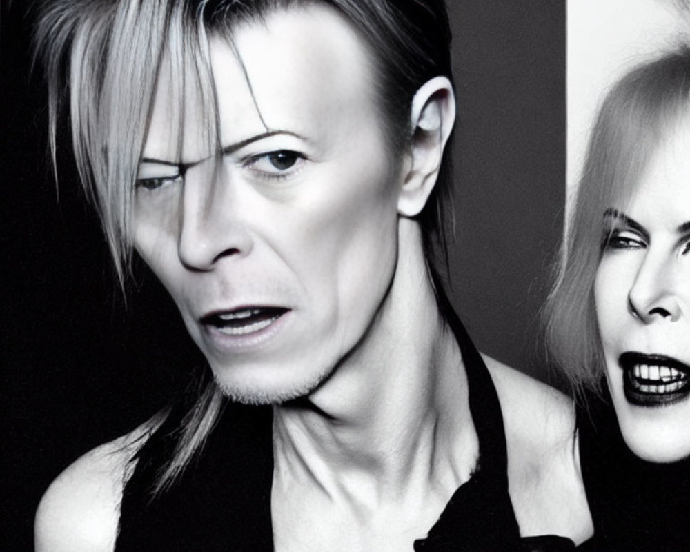 Monochrome photo of two individuals with bold makeup and edgy hairstyles