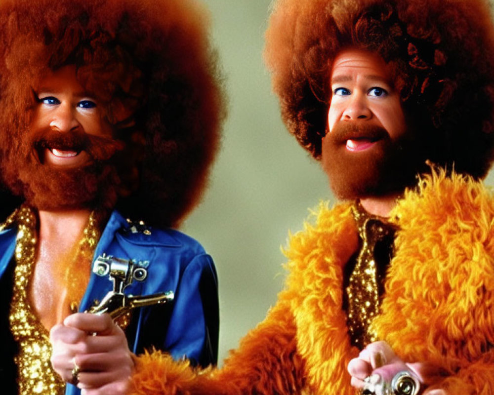 Two individuals in large afros and orange furry outfits in a humorous style.