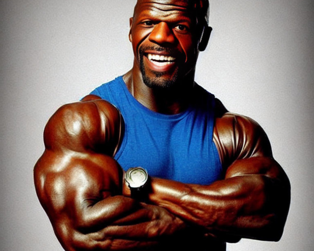 Muscular person in blue sleeveless top flexing arms on gray background