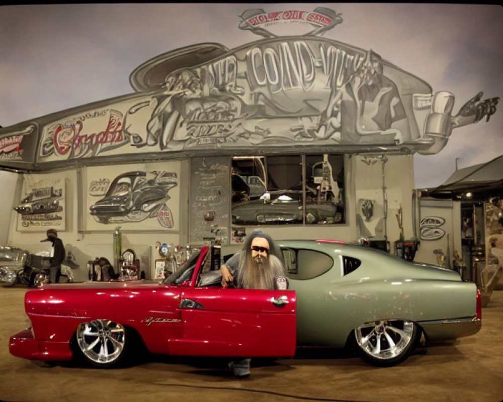 Bearded man in vintage car at custom car show with banners