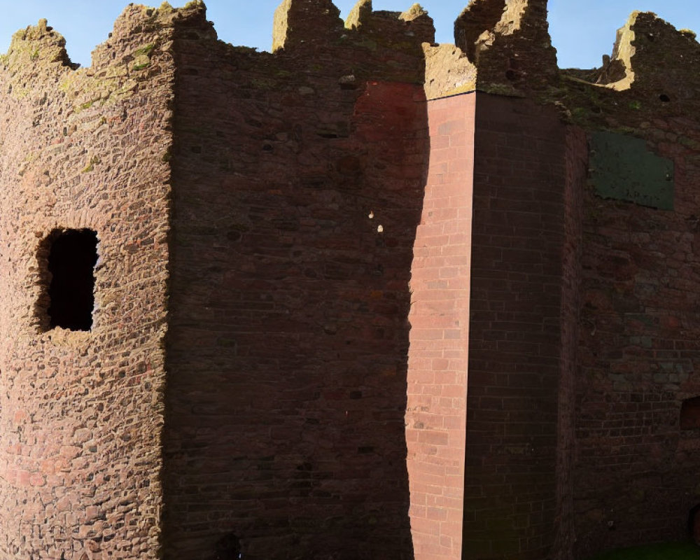 Weathered Red Brick Ancient Castle Ruin on Green Lawn