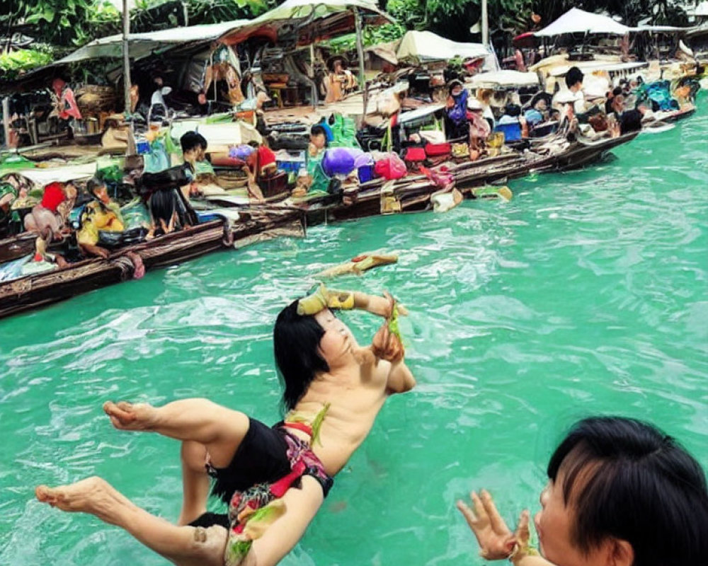 Two people in green water with boats and market stalls in the background.