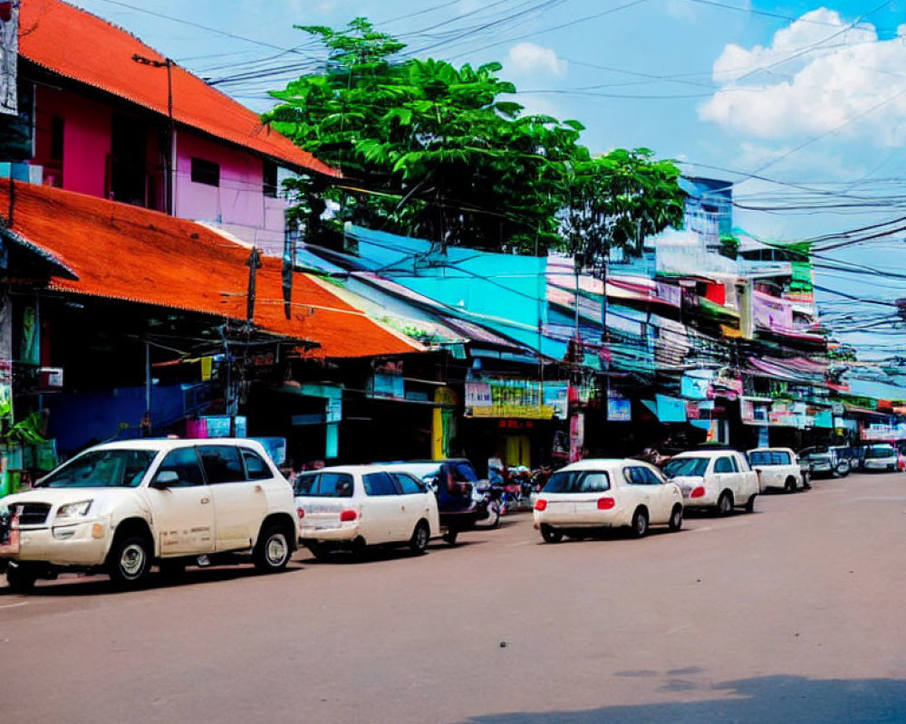 Vibrant Street Scene with Colorful Buildings and Parked Cars