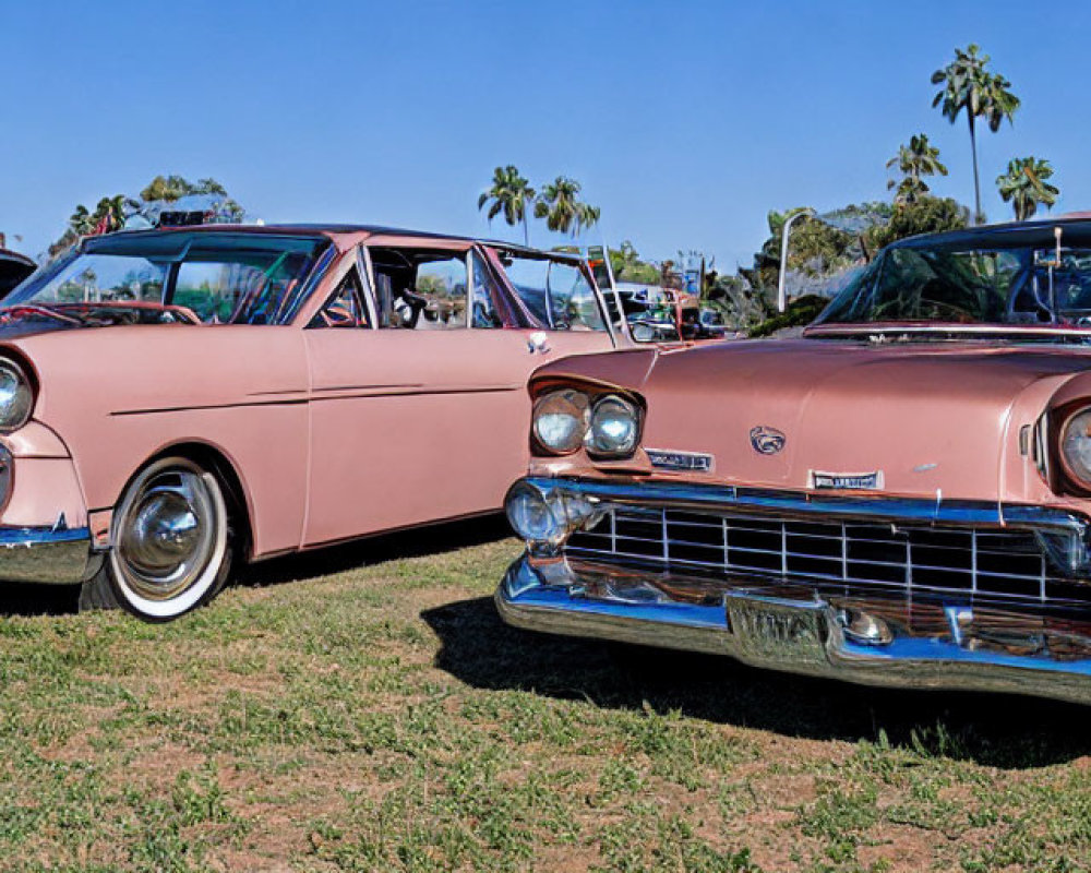 Vintage Pink Cars with Chrome Detailing at Outdoor Car Show