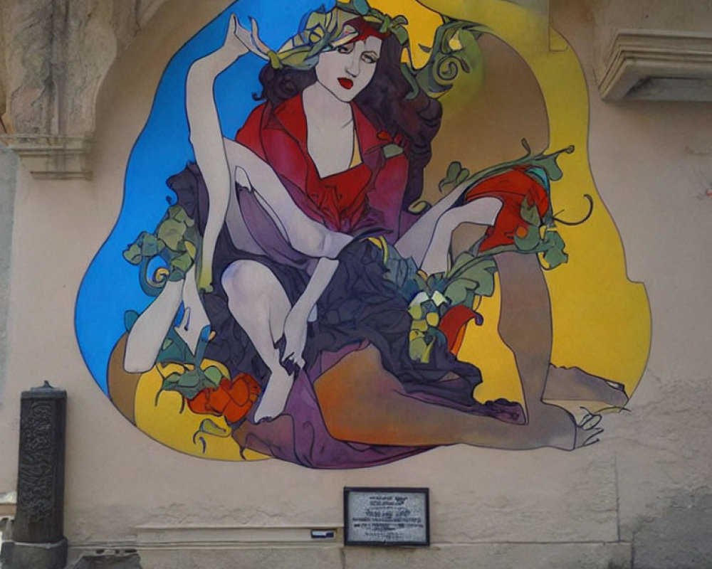 Vibrant woman mural with vines on urban wall and plaque