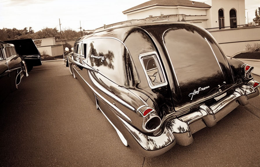 Vintage Black Hearse with Tail Fins and Chrome Details in Sepia-Tone Setting