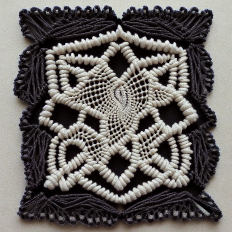 Geometric black and white macramé with tassels and intricate patterns