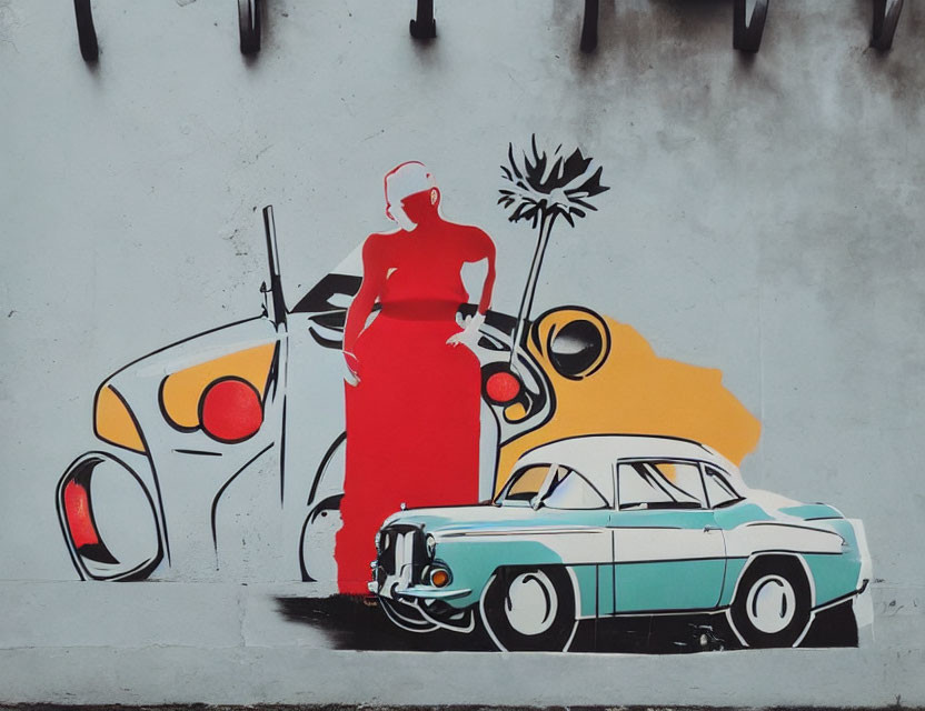 Colorful street art mural with classic car and figure in red dress on grey wall