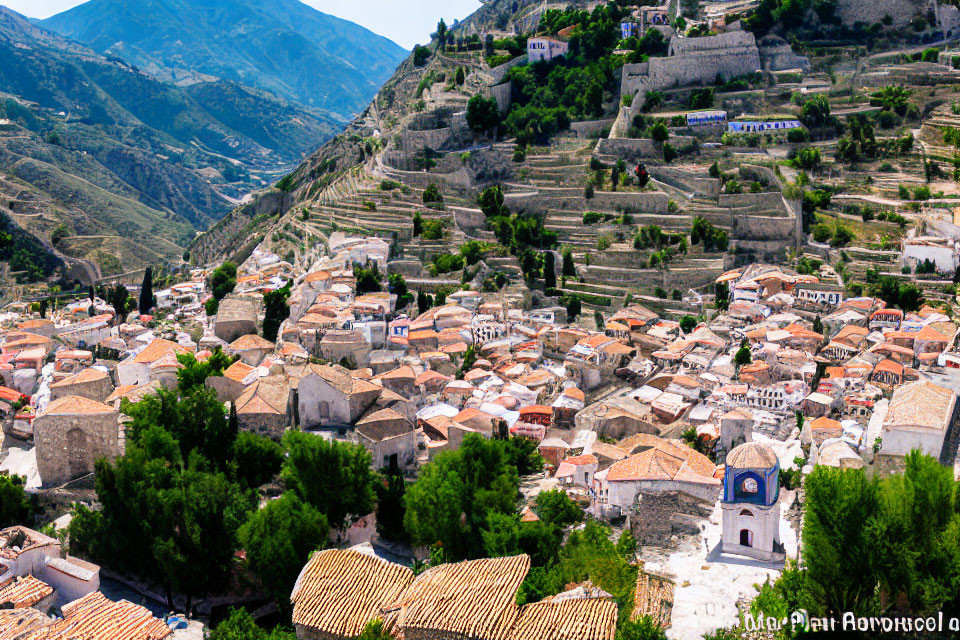 Scenic hillside village with terraced plots and bell tower