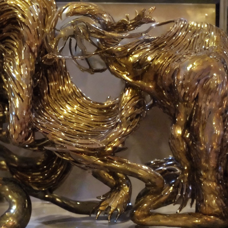 Dynamic Golden Bull Sculpture with Intricate Swirling Textures