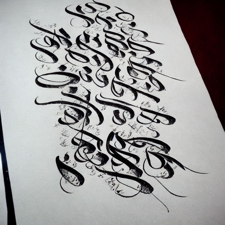 Detailed Black Calligraphy Artwork on White Paper