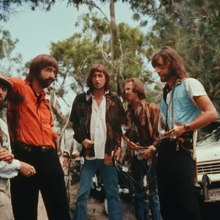 1970s Men in Vibrant Shirts and Flared Trousers Outdoors