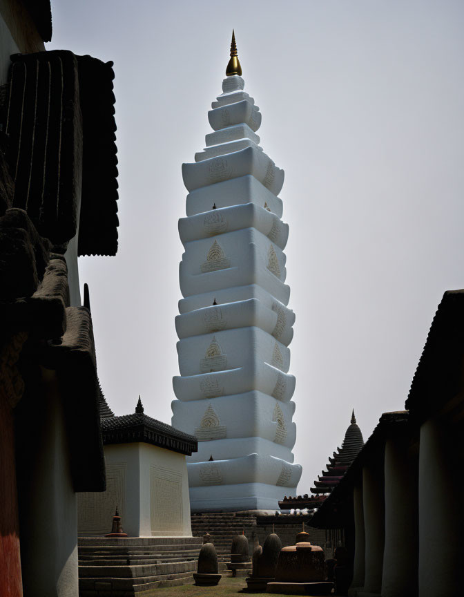 White Pagoda with Golden Accents in Traditional Setting