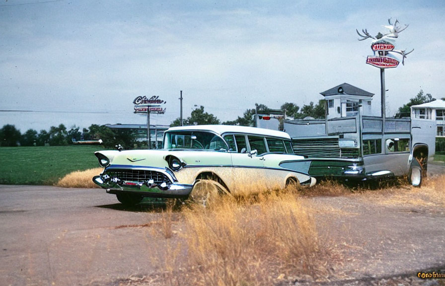 Vintage Turquoise and White Chevrolet at Classic Diner with Neon Signs