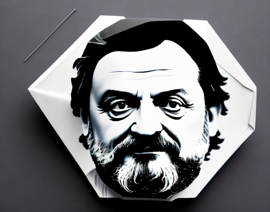 Monochromatic graphic of bearded man's face on crumpled paper with needle on grey background