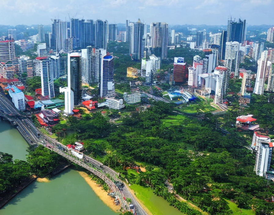 Vibrant city skyline with river and green spaces under cloudy sky