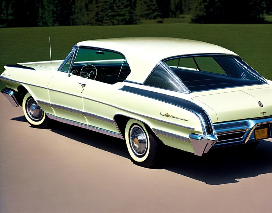 Classic Two-Tone Car with White Top and Pale Yellow Body and Large Tailfins Parked on