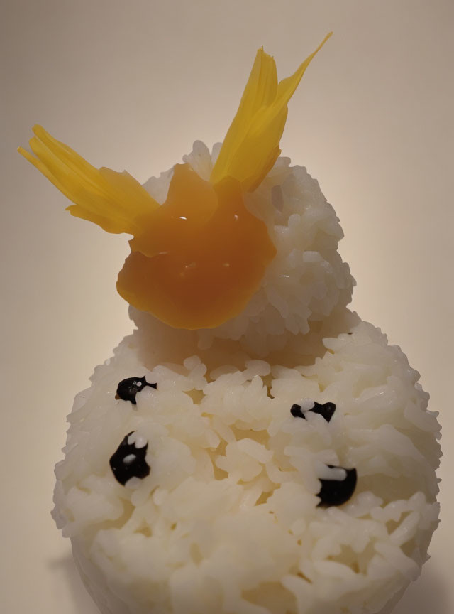 Snowman-Shaped Rice with Egg Yolk and Sesame Seed Eyes