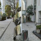 Geometric Metal Sculpture of Interconnected Crystalline Shapes in Bright Courtyard